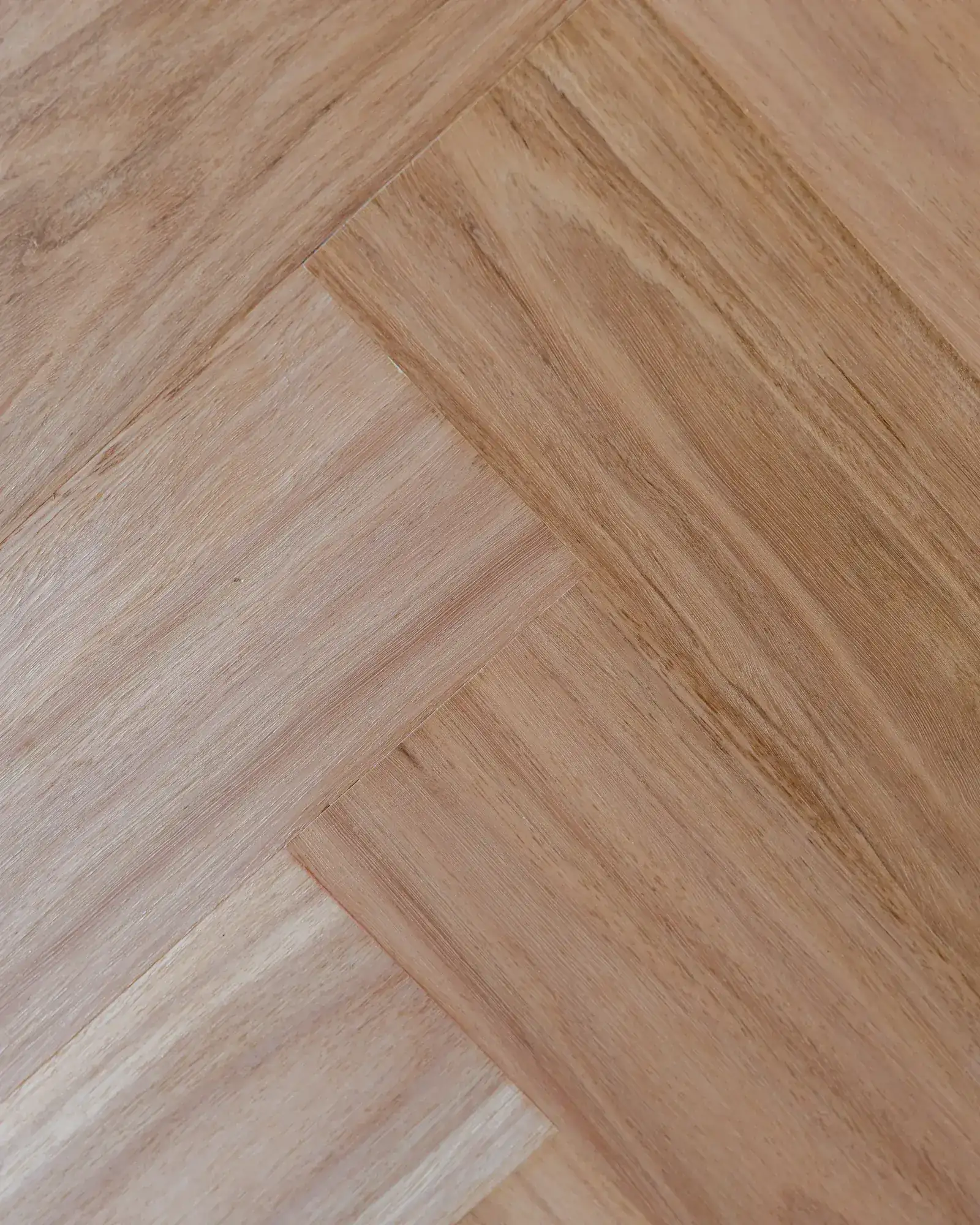 Herringbone timber flooring laid through the Dudley build