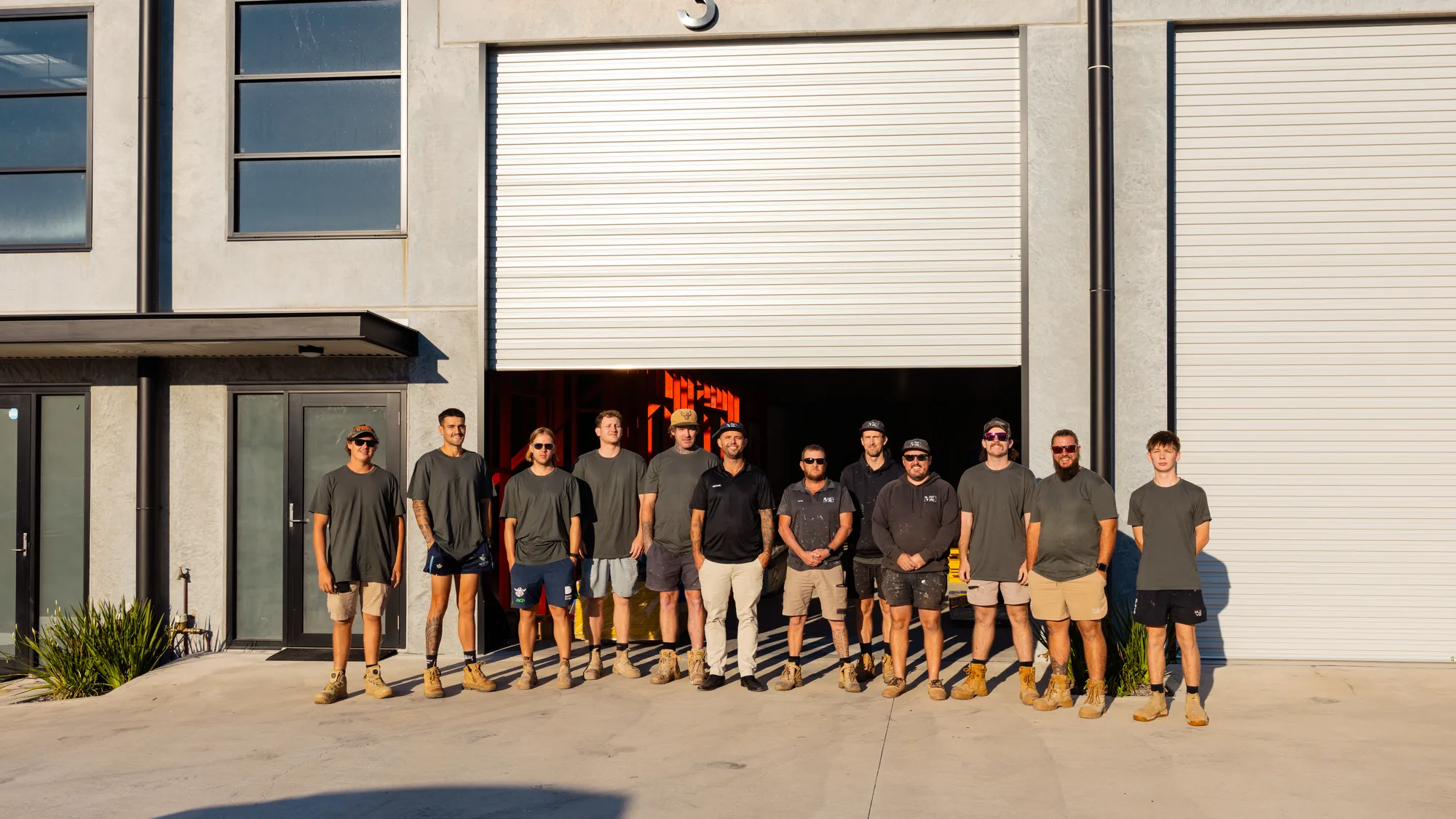 The Michael Bell Construction team outside the workshop